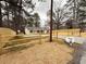 A view of the newly renovated house with wood accents on the windows and the new fence surrounding the property at 413 Cranfill Se Rd, Marietta, GA 30060