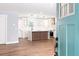 View of kitchen featuring a modern island and white cabinets from the front entrance at 413 Cranfill Se Rd, Marietta, GA 30060