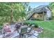 Backyard with a stone patio, fire pit, and outdoor furniture beneath a multi-level deck at 27 Danbury Hill # Coweta, Sharpsburg, GA 30277