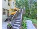 Back of home with deck access, slide, stairs, and a landscaped backyard at 27 Danbury Hill # Coweta, Sharpsburg, GA 30277