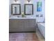 Stylish bathroom with dual sinks, soaking tub, and modern fixtures at 27 Danbury Hill # Coweta, Sharpsburg, GA 30277