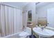 Bathroom with a shower-tub combo, a pedestal sink, and a toilet at 27 Danbury Hill # Coweta, Sharpsburg, GA 30277