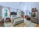 Bright bedroom featuring hardwood floors, large windows, and comfortable furnishings at 27 Danbury Hill # Coweta, Sharpsburg, GA 30277