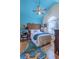 Bedroom with blue textured ceiling and a large carved headboard at 27 Danbury Hill # Coweta, Sharpsburg, GA 30277