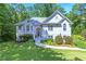 Charming traditional home featuring a manicured lawn and a light gray exterior at 27 Danbury Hill # Coweta, Sharpsburg, GA 30277