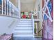 View of the interior staircase with stylish decor and high ceilings at 27 Danbury Hill # Coweta, Sharpsburg, GA 30277
