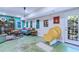Basement living area with a daybed, a yellow slide, windows, and an exit door at 27 Danbury Hill # Coweta, Sharpsburg, GA 30277