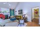 Cozy living room with hardwood floors, a fireplace, and stylish decor at 27 Danbury Hill # Coweta, Sharpsburg, GA 30277