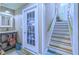 Entryway with utility sink, staircase, and glass paneled door to the exterior at 27 Danbury Hill # Coweta, Sharpsburg, GA 30277