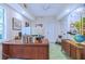Home office with large desk, monitors, and painted concrete flooring at 27 Danbury Hill # Coweta, Sharpsburg, GA 30277