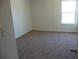 Bright bedroom featuring carpet and a window at 52 Providence Oak Ct, Lawrenceville, GA 30046