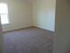 Spacious bedroom with carpet and window at 52 Providence Oak Ct, Lawrenceville, GA 30046