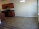 Simple dining area with tile flooring and kitchen access at 52 Providence Oak Ct, Lawrenceville, GA 30046