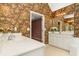 Bathroom with white vanity, granite countertop and flower wallpaper at 4311 Clairesbrook Ln, Acworth, GA 30101