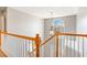 Bright foyer with natural light, a wooden staircase, and views of the front door, offering a welcoming entry at 4311 Clairesbrook Ln, Acworth, GA 30101