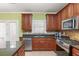 Well-equipped kitchen with stainless steel appliances, granite countertops, and ample cabinet space at 4311 Clairesbrook Ln, Acworth, GA 30101
