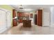 Eat-in kitchen features wood cabinets, a stainless steel oven, black fridge, and island with barstool seating at 4311 Clairesbrook Ln, Acworth, GA 30101