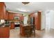 Well-lit kitchen with wood cabinets, a stainless steel oven and black refrigerator, plus a granite topped island at 4311 Clairesbrook Ln, Acworth, GA 30101