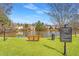 Community lake view featuring green space, a bench, and walking path at 4311 Clairesbrook Ln, Acworth, GA 30101