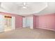 Spacious main bedroom with tray ceiling, carpet flooring, and two doors, creating a luxurious retreat at 4311 Clairesbrook Ln, Acworth, GA 30101