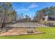 Community pool area featuring picnic tables surrounded by a secure metal fence at 4311 Clairesbrook Ln, Acworth, GA 30101