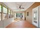Relaxing sun room with tile floors, lots of natural light, and views of the outdoors, creating a peaceful retreat at 4311 Clairesbrook Ln, Acworth, GA 30101