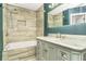 Luxurious bathroom showcasing a stylish vanity, a bathtub, and modern tile work at 6323 Wedgeview Dr, Tucker, GA 30084