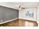 Bedroom with wood floors, a modern ceiling fan, and a window at 6323 Wedgeview Dr, Tucker, GA 30084