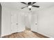 This is a cozy bedroom featuring a ceiling fan and wood-look flooring at 6323 Wedgeview Dr, Tucker, GA 30084