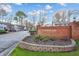 Brick entrance sign with flower bed for Wedgewood community at 6323 Wedgeview Dr, Tucker, GA 30084