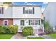 Charming two-story townhome with well-maintained landscaping, a cozy front porch, and inviting curb appeal at 6323 Wedgeview Dr, Tucker, GA 30084