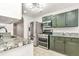 Kitchen area with granite countertops, stainless steel appliances, and tile flooring at 6323 Wedgeview Dr, Tucker, GA 30084