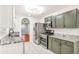 A spacious kitchen features sleek, stainless steel appliances and granite countertops, offering a modern and functional design at 6323 Wedgeview Dr, Tucker, GA 30084