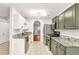 A well-lit kitchen features stainless steel appliances, marble countertops, and ample cabinet space for modern living at 6323 Wedgeview Dr, Tucker, GA 30084