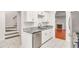 Modern kitchen featuring granite countertops, stainless steel appliances, and access to an open-concept living area at 6323 Wedgeview Dr, Tucker, GA 30084