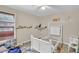 Bright bedroom with neutral paint, a large window, carpet floors and a ceiling fan at 6705 Brookline Ct, Cumming, GA 30040