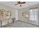 Cozy bedroom with neutral walls, carpet flooring, and a decorated desk at 6705 Brookline Ct, Cumming, GA 30040