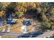 Aerial view of a house surrounded by autumn trees, showcasing the property's generous lot size at 5747 S Gordon Rd, Austell, GA 30168