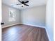 This bedroom features contemporary wood look flooring and a ceiling fan at 5747 S Gordon Rd, Austell, GA 30168