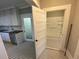 Bright bathroom features a black and white tiled floor and a shower and tub combination at 31 N Broad N St, Porterdale, GA 30014