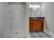 Modern bathroom featuring a sleek glass shower and stylish vanity with dual mirrors at 31 N Broad N St, Porterdale, GA 30014
