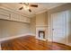 Bedroom features a fireplace, built-in shelving, and hardwood floors at 31 N Broad N St, Porterdale, GA 30014
