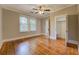 Bright bedroom featuring hardwood floors, large windows, and a closet at 31 N Broad N St, Porterdale, GA 30014