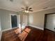 Bedroom with hardwood floors and two doors, featuring great natural lighting at 31 N Broad N St, Porterdale, GA 30014
