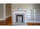 Living room displaying a historic fireplace and built-in shelving at 31 N Broad N St, Porterdale, GA 30014