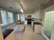 Bright kitchen featuring black and white floors, white cabinetry, wooden countertops, and stainless steel appliances at 31 N Broad N St, Porterdale, GA 30014