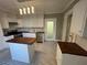 Charming kitchen featuring white cabinetry, wooden countertops, stainless steel appliances, and a center island at 31 N Broad N St, Porterdale, GA 30014