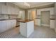 Charming kitchen with checkerboard floors and a butcher block island at 31 N Broad N St, Porterdale, GA 30014