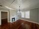 Open floor plan living room with refinished hardwood floors, fireplace, and natural light at 31 N Broad N St, Porterdale, GA 30014