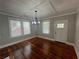 Open concept living room with new lighting, refinished floors, and neutral paint at 31 N Broad N St, Porterdale, GA 30014